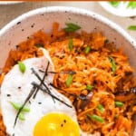 kimchi fried rice served with sunny side up with text