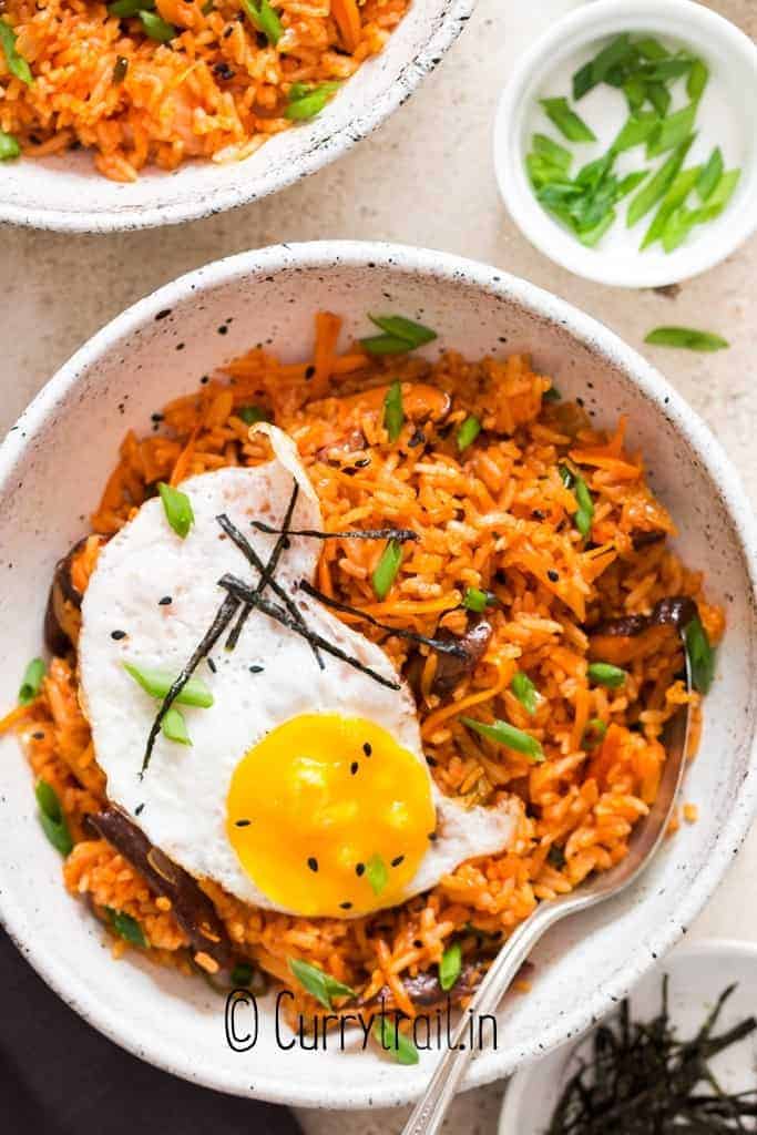 kimchi fried rice with sunny side up egg in bowl