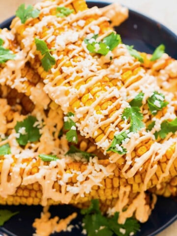 corn ribs drizzled with chili mayonnaise and Cotija cheese