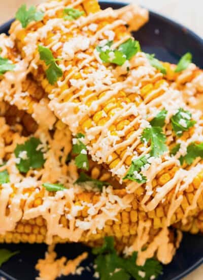 corn ribs drizzled with chili mayonnaise and Cotija cheese