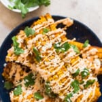 corn ribs with chili mayonnaise and cotija cheese with text