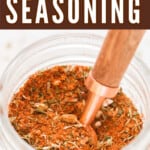 creole seasoning in a jar with text overlay