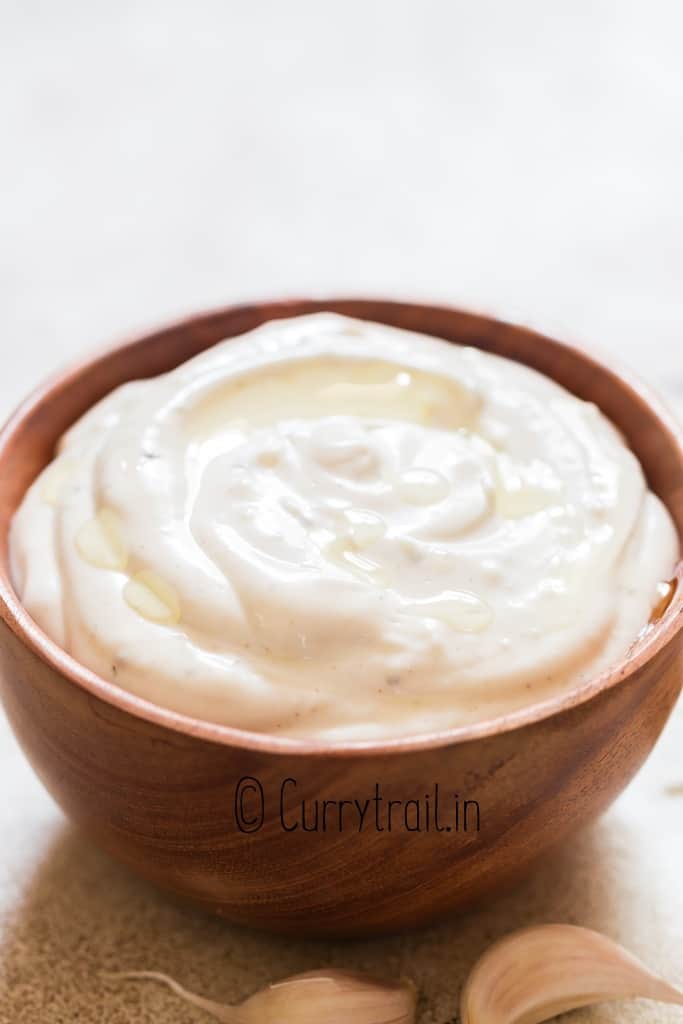 garlic aioli sauce in wood bowl