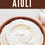cheat version of garlic aioli in wood bowl with text