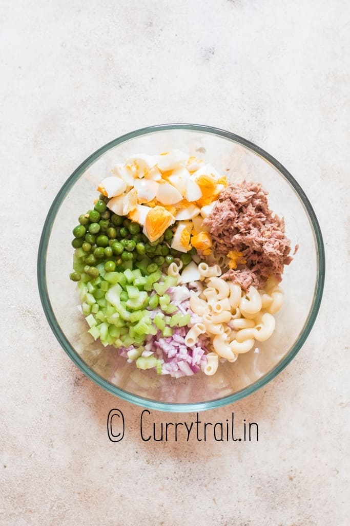 making macaroni tuna salad in bowl