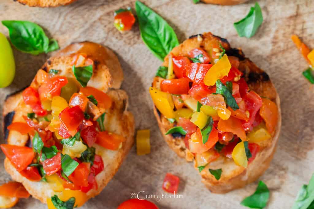 tomato basil mix topped over the grilled bread slice.