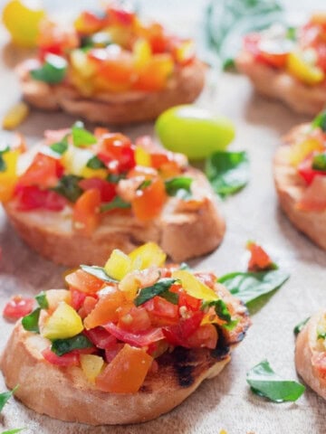 tomato basil mix topped over the grilled bread slice.