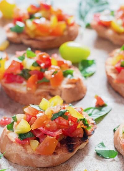 tomato basil mix topped over the grilled bread slice.