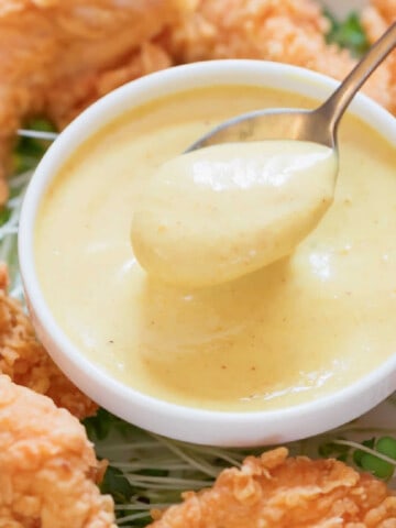 close view of dipping sauce with fried chicken