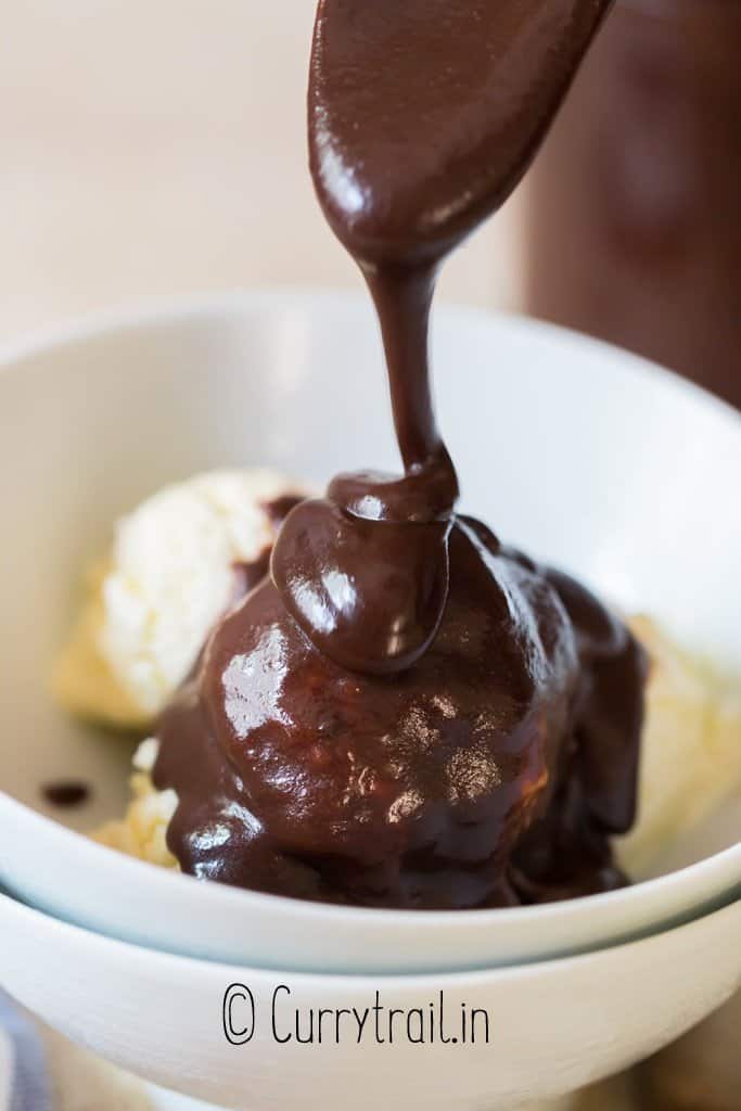 hot fudge sauce poured over ice cream