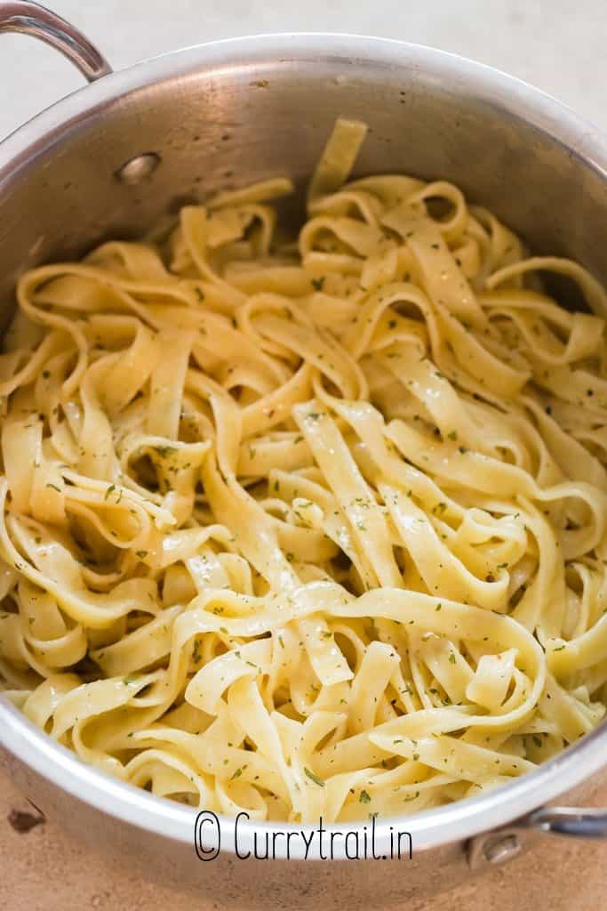 pasta in butter sauce in pan