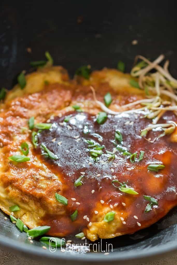 close view of Chinese omelette with gravy sauce