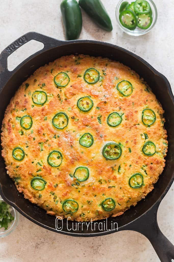 cornbread with jalapenos and cheddar cheese in cast iron pan