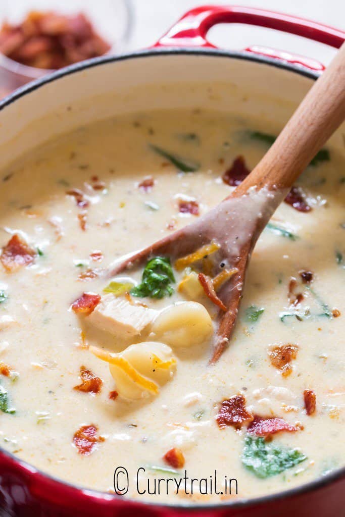 potful of chicken gnocchi soup loaded with bacon