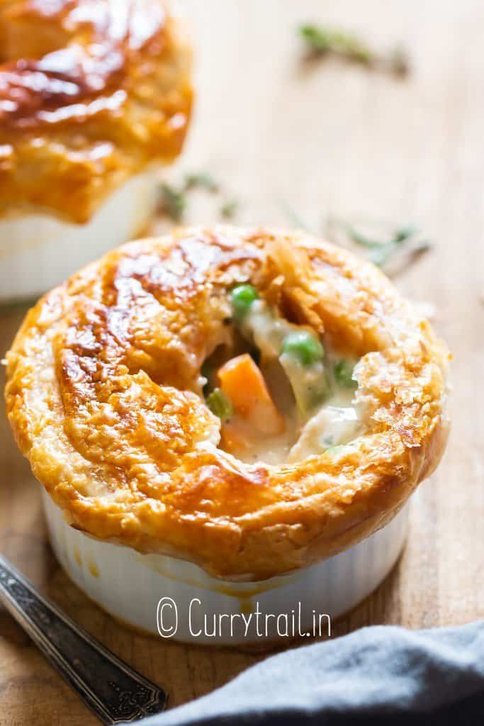 puff pastry topped small pot pie with chicken filling
