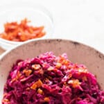 braised red cabbage with bacon with text overlay
