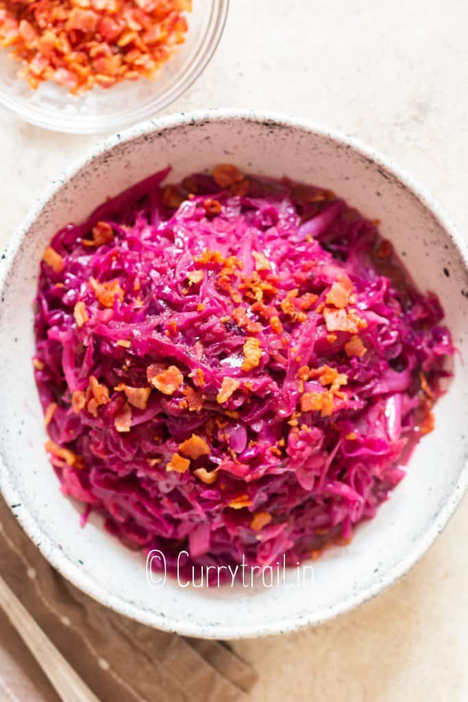 red cabbage braised with apples served in white bowl