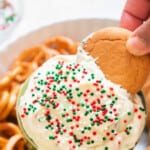 cookie dipped in Christmas dip with text