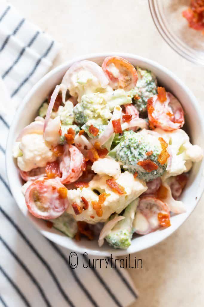 Christmas salad with broccoli and cauliflower with bacon crumbs