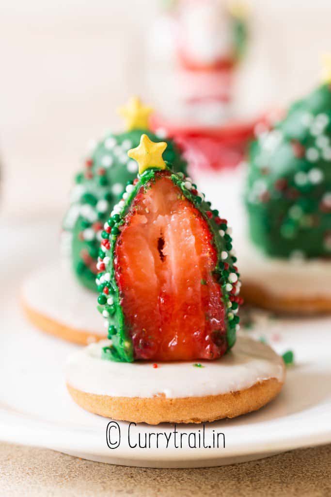 strawberries dipped in green chocolate with sprinkles