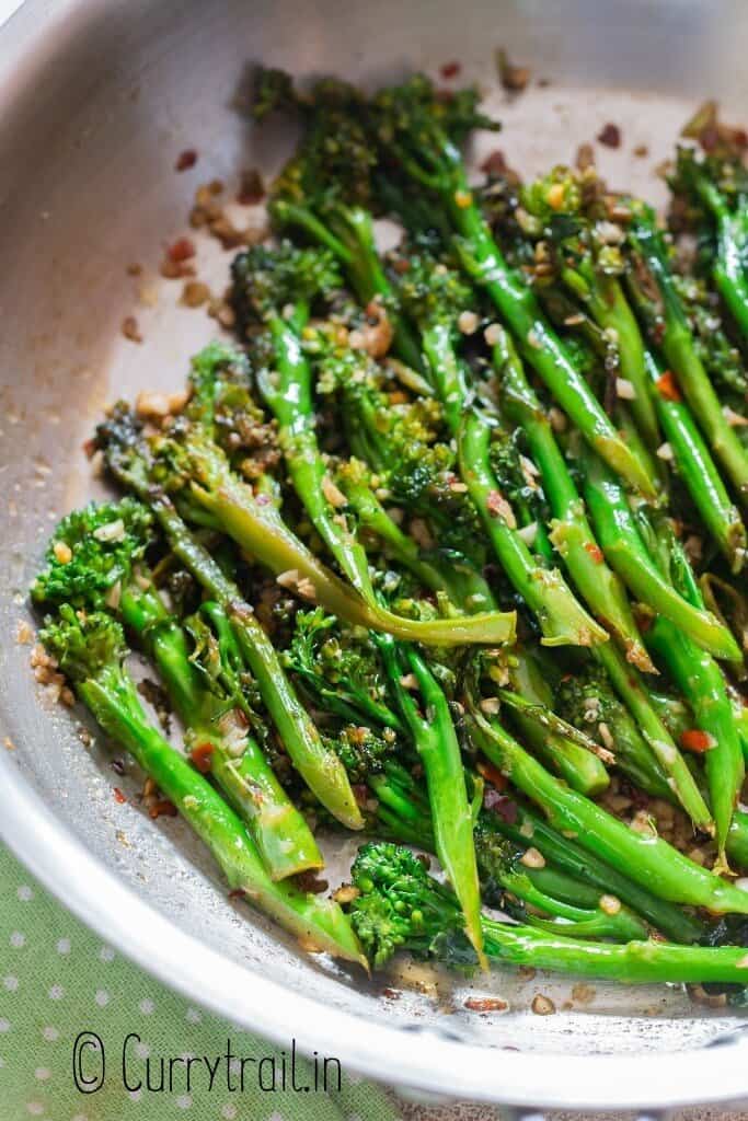 sauteed broccolini with garlic and lemon cooked in skillet