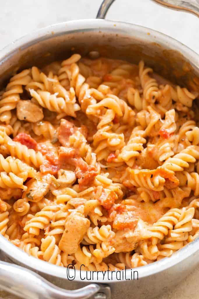 creamy chicken tomato pasta cooked in pot