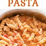 chicken pasta in tomato sauce with text overlay