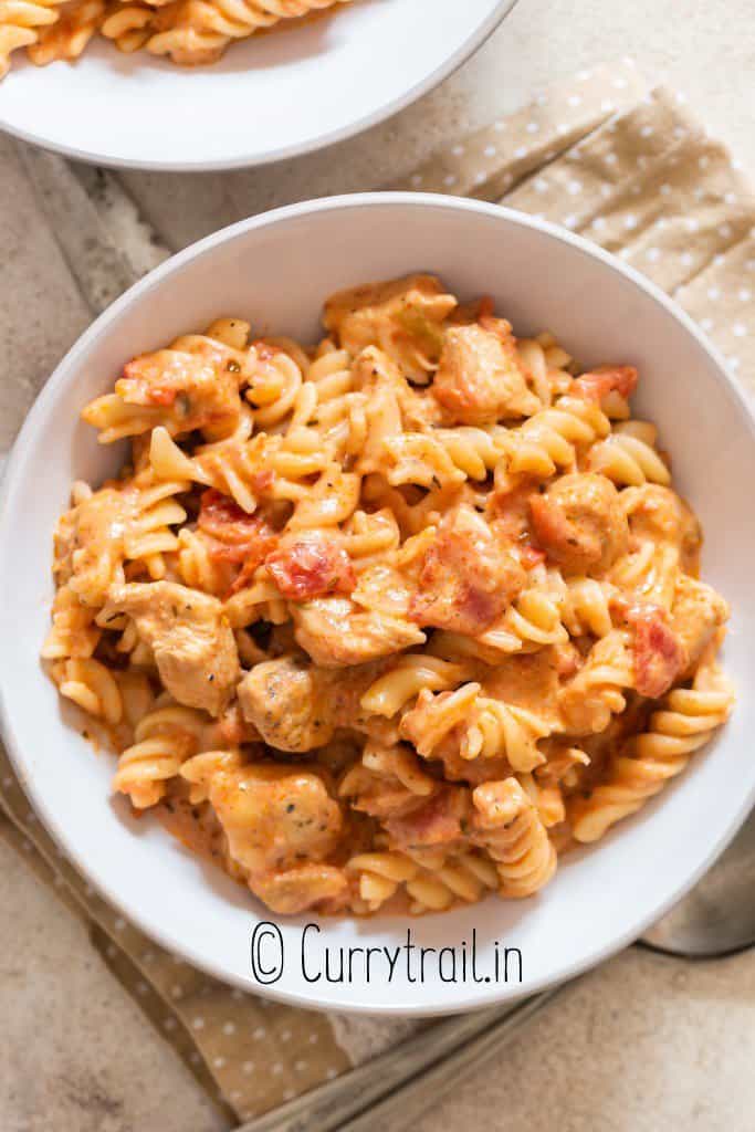 chicken tomato pasta in bowl