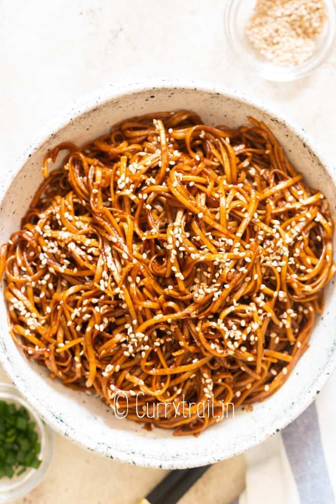 Japanese hibachi noodles in bowl with sesame seed garnish