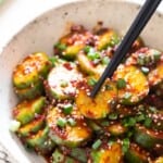 close view of spicy Korean cucumber salad in bowl