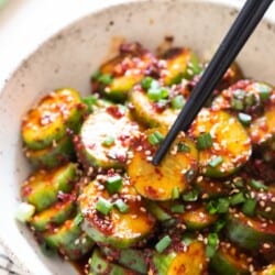 close view of spicy Korean cucumber salad in bowl