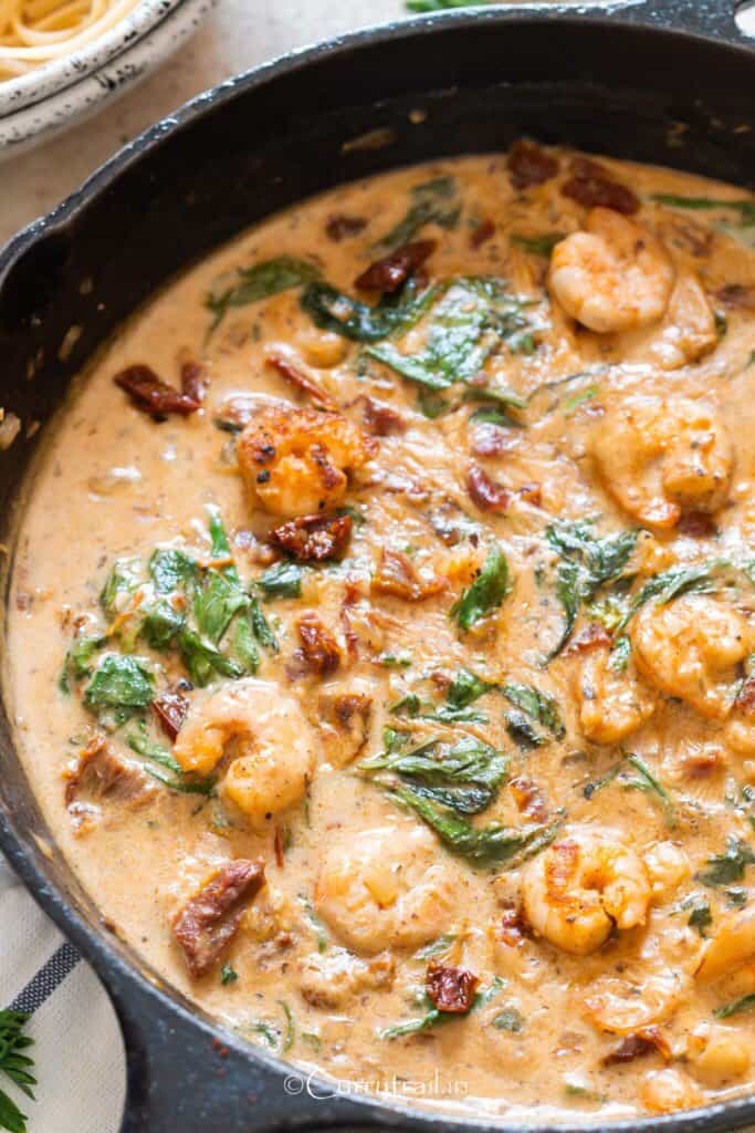 creamy Tuscan shrimp in cast iron skillet