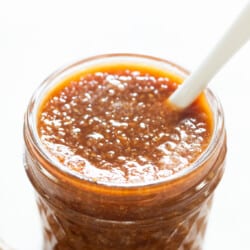 close up view of dipping sauce with ginger in jar