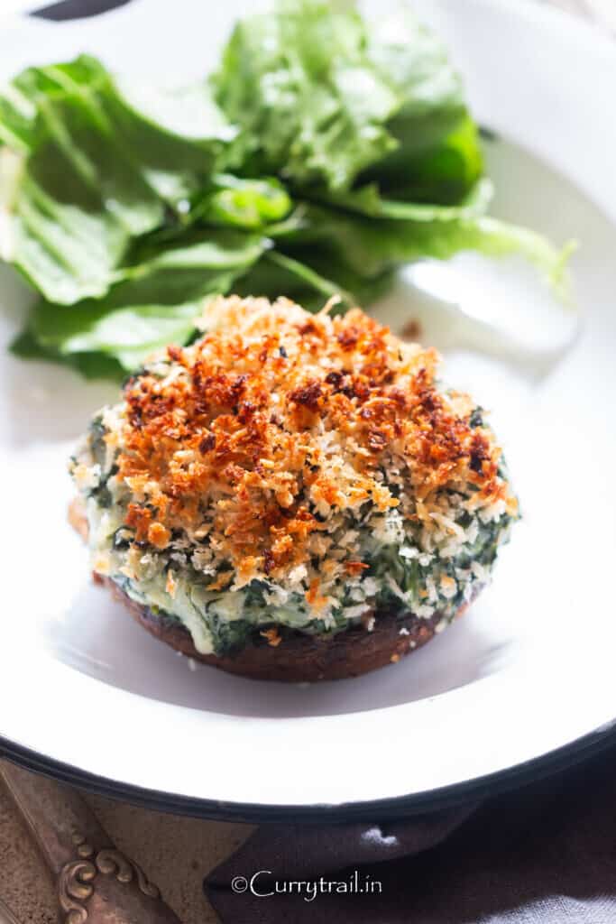 close up view of portobello stuffed mushrooms