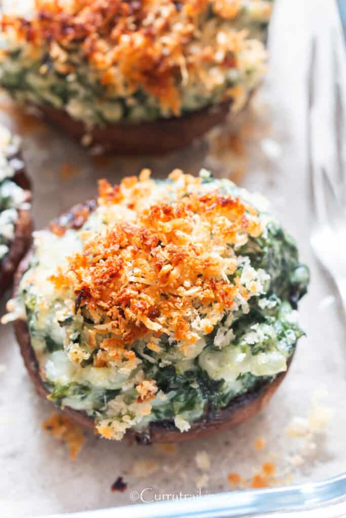 close up view of portobello stuffed mushrooms