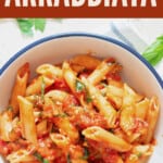 spicy penne arrabbiata in bowl with text