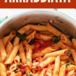 spicy penne arrabbiata in pan with text