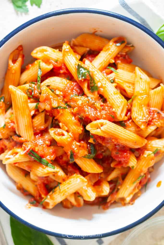 penne pasta in arrabbiata sauce in bowl