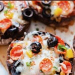 close up view of Portobello mushroom pizza with text