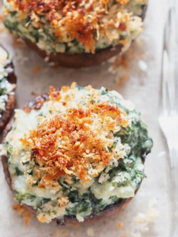 close up view of spinach stuffed mushrooms