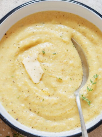 creamy polenta in bowl with butter