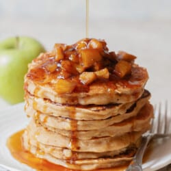 stacks of apple pancakes with cinnamon apple toppings