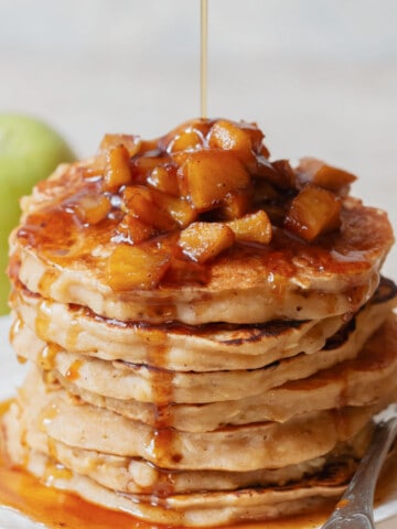 stacks of apple pancakes with cinnamon apple toppings