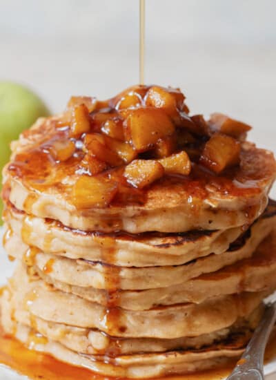 stacks of apple pancakes with cinnamon apple toppings