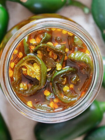 close up view of jalapenos preserved in syrup