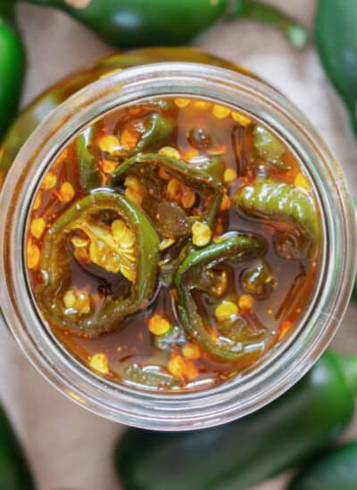 close up view of jalapenos preserved in syrup