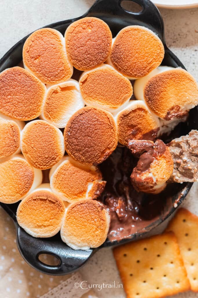 indoor smores dip made in cast iron pan