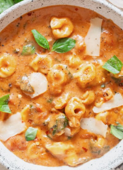 a bowl of tortellini soup