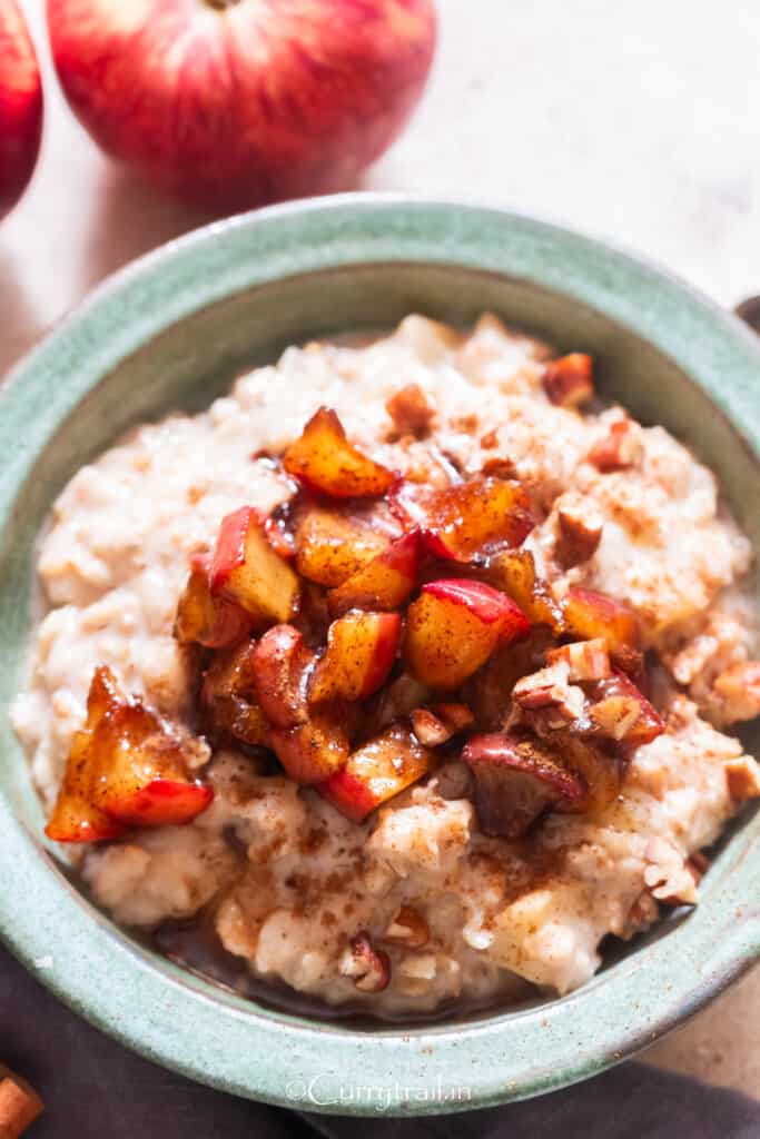 a bowl of apple oatmeal with cinnamon apples