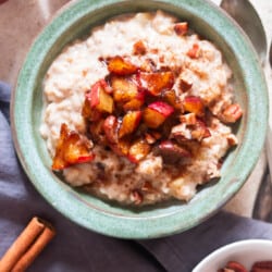 a bowl of apple oatmeal with cinnamon apples